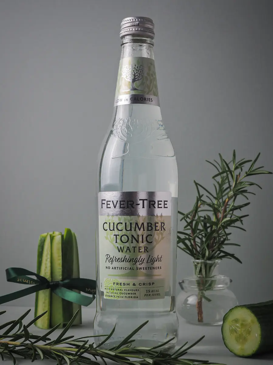 A bottle of Fever-Tree Cucumber Tonic Water displayed with fresh cucumber slices