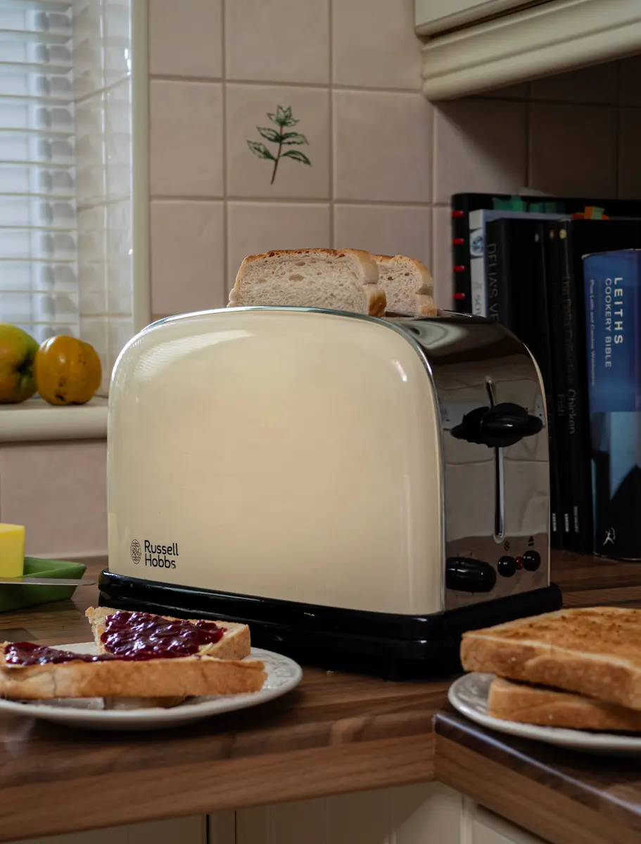 Toast popping out of a retro cream toaster